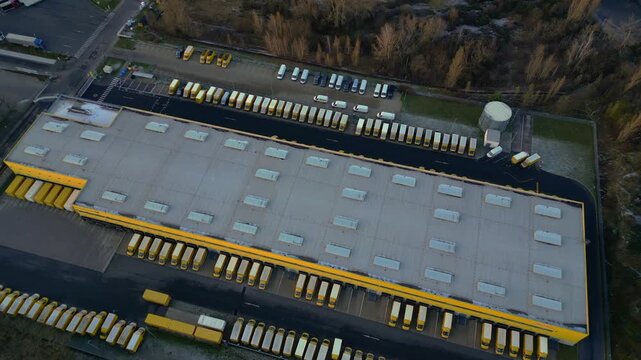 Logistics center, delivery vans distribution. Majestic aerial view flight drone