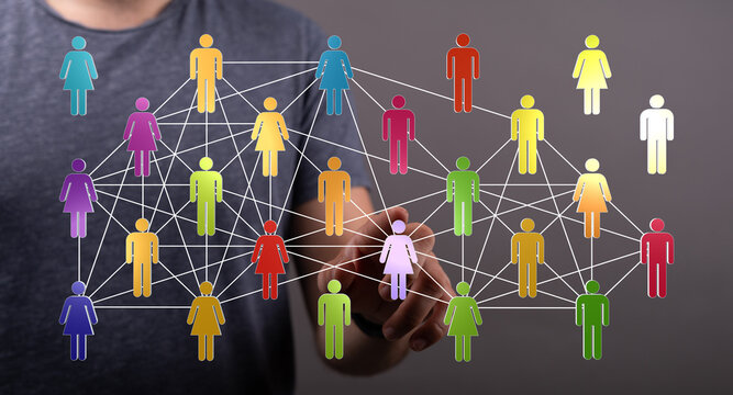 Digitally enhanced image of a hand interacting with a network of colorful figures, representing teamwork, colla