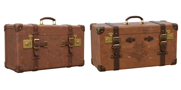 Two vintage leather suitcases with ornate gold hardware and buckles