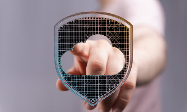 Abstract cloud security concept with a hand pointing towards a digital cloud shield. Data protection and secure