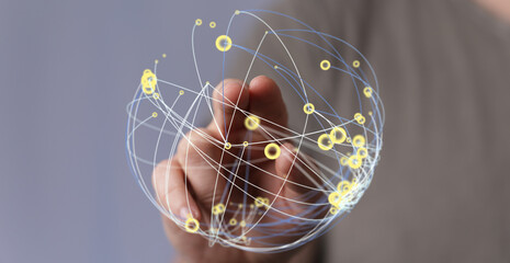 Hand reaching towards a digital sphere representing global connection, network, and communication. Concept of internet, globalization