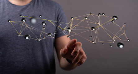 Abstract image showing a hand pointing at network connections. Concept of technology, connection, and data visu