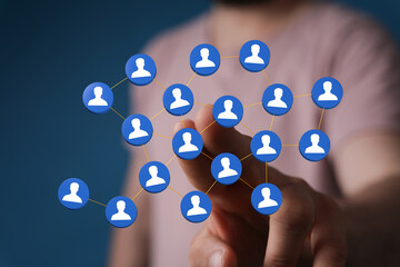 Close-up of a hand interacting with a digital network, representing connection, communication, and social media