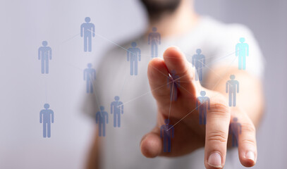 Close up of a hand touching a digital interface representing a human network. Concept of connection, future, an