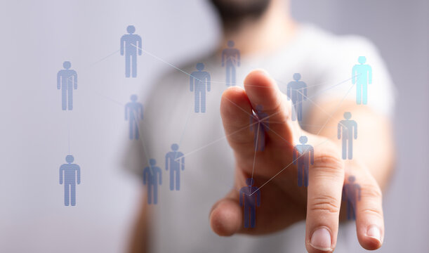 Close up of a hand touching a digital interface representing a human network. Concept of connection, future, an