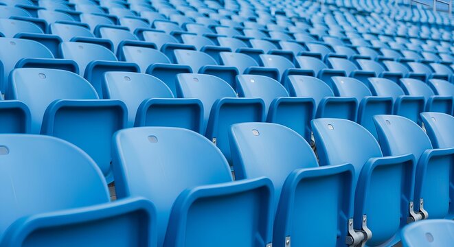 Rows of empty blue plastic stadium seats arranged in a semi-circular formation