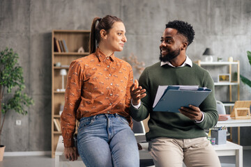 Diverse business professionals having a casual office conversation