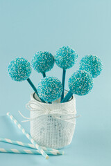 Maria cookie cake pops coated in blue and white aniseed sprinkles.