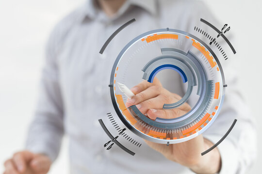 Business professional using a virtual interface, representing innovation, data visualization, and technological advancement in a modern workspac