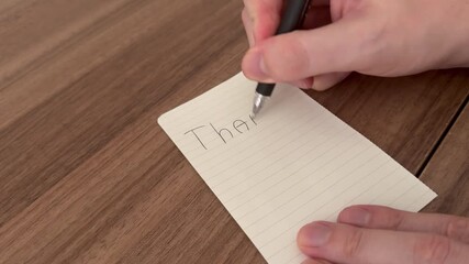 Hand written Thank you notes on a wooden background. Happy Thanksgiving day.