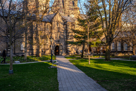 Historic campus building in warm evening light - Powered by Adobe