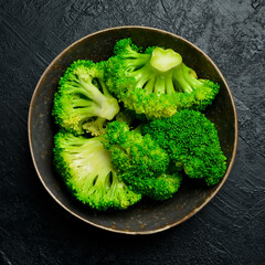 Boiled broccoli in a ceramic bowl, ready to eat. Close-up. Concept of healthy diet food.