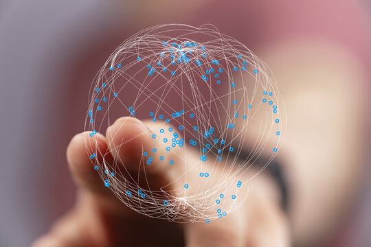 Digitally rendered globe of connected nodes held gently in a human hand symbolizing global communication networks, future technology,