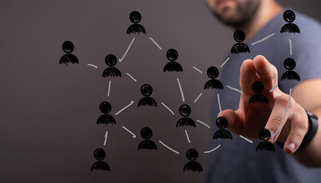 Hand interacting with digital network interface. Illustrating connections, communication, and social structure in a technology or business conte