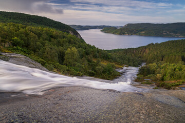 view of the Skrelia waterfall and the Lyngdalsfjorden in southern Norway
