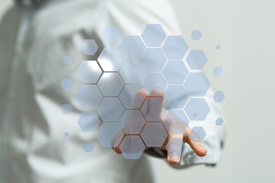 Hand touching digital hexagon screen. Concept of technology, future, innovation, and digital interface, user ex - Powered by Adobe