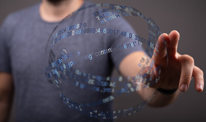 A man's hand interacting with a glowing digital data sphere, representing technology, innovation, and interconnectedness. Ideal for t