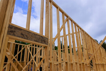 Wooden framing of building is being constructed, beams timber framework construction