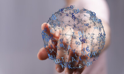 Close-up of a hand holding a glowing digital sphere representing network, data, and global connectivity.