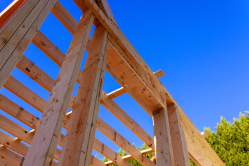 Wooden beams frame construction under building process materials used.