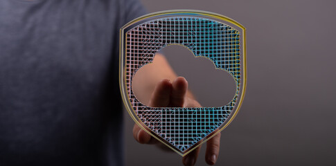 Digitally rendered image of a hand holding a glowing cloud computing symbol, representing data...