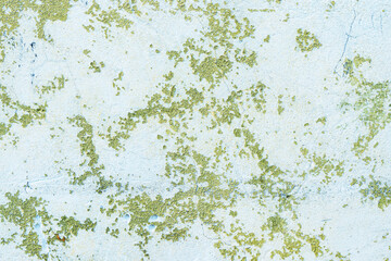 Peeling painted concrete wall, cracks of green blue and beige, peeling paint of the old rough concrete wall, peeling paint texture