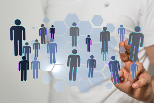 Concept of global community and digital connections. Businessman hand interact with the human icons with hexago