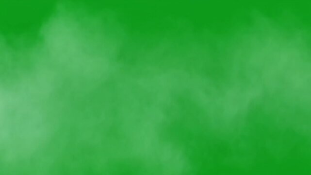 Green screen background with wisps of white smoke or fog drifting across, perfect for visual effects and compositing in video production