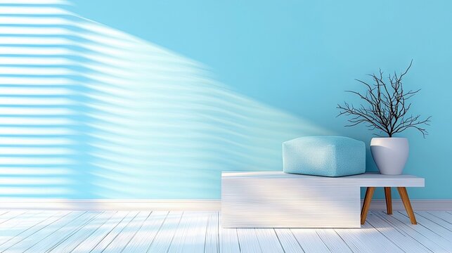 A clean, minimalist interior scene featuring a light blue ottoman and a white vase with a bare branch plant on a white bench. Natural light streams through blin