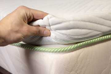 Hand is touching white soft mattress.
Topper mattress with a core of pressure-relieving gel foam. Adapts to body and leads away excess heat.