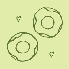 Two delightful doodle-style matcha green tea donuts, beautifully glazed, sit side-by-side on a soft light green background.