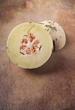Dino melon, cut, on the table, top view, no people,
