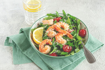 Shrimp salad with arugula and cherry tomatoes, with parmesan cheese, healthy food,