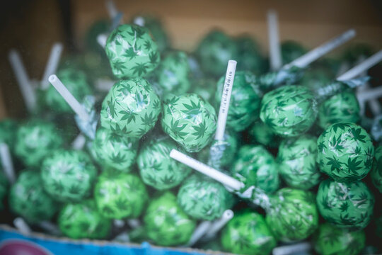 Green lollipops with marijuana leaf patterns in a box. Amsterdam,. Netherlands
