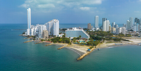 Coastal city skyline with tall modern buildings and a clear blue sky. Cartagena, Colombia