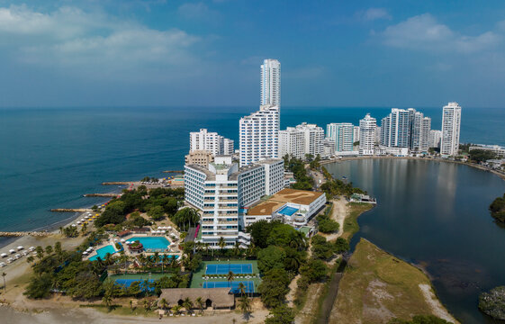 Aerial view of coastal city skyline with tall buildings and ocean backdrop. Cartagena, Colombia