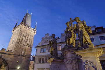 Religious statue of Vitus with Mal&aacute; Strana Bridge Tower, Charles Bridge, Czech Republic