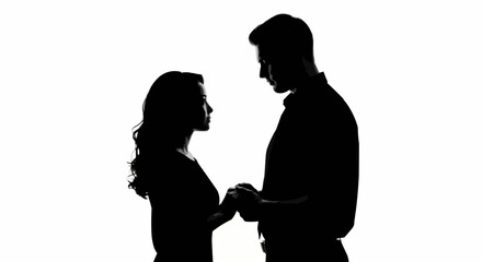 Silhouette of a couple holding hands, romantic and intimate moment.