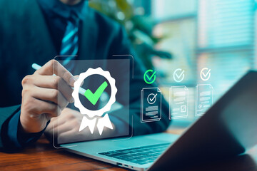 Business person using a digital pen to approve a certification badge and verified documents on a laptop, symbolizing quality assurance, compliance, validation, and professional digital workflow