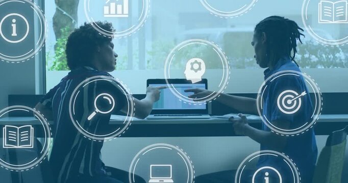 Right peer pointing at laptop, left peer leaning, working as HUD icons tagging charts for education