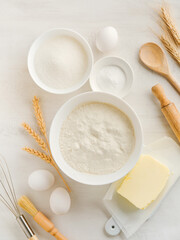 Culinary background with Ingredients for cooking Christmas baking on old white wooden background table. Top view. Christmas holiday kitchen background. Design element.