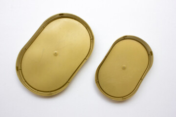 Some colorful plastic container lids on a white background, copy space, background and texture