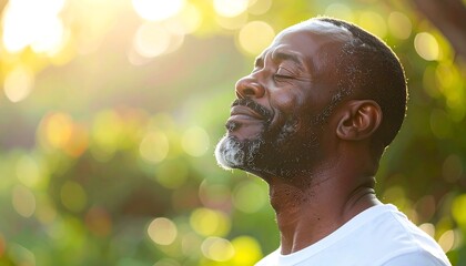 Serene African American Man Meditating Outdoors in Natural Light.
