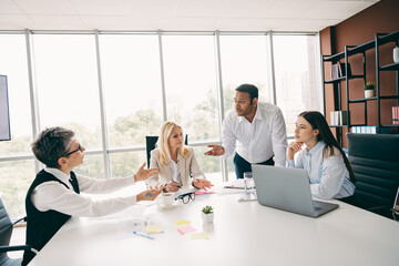 Professional team collaborating in a modern office environment during a business meeting to discuss strategy and management