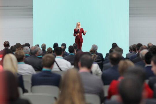 Woman with a microphone on stage