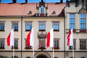 A photo of four Polish flags on a flagpole