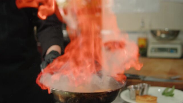 Frying peach slices in butter in a frying pan, grilled peaches, sugar dessert cooking in modern restaurant. - Powered by Adobe