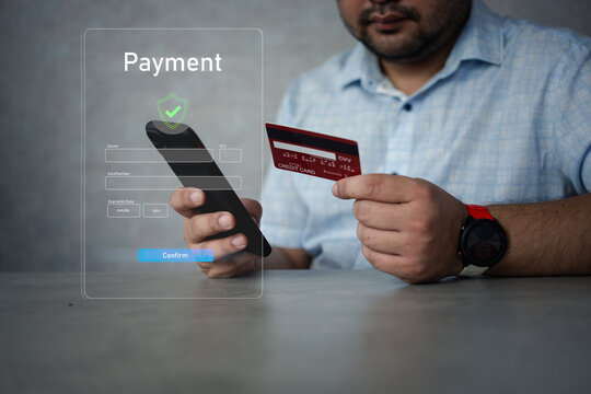 Man using credit card for online payment with digital payment icons on screen. Online shopping, internet banking or purchase - Powered by Adobe