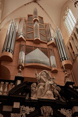 God the Father sculpture beneath organ pipes in Saint Salvator's Cathedral, Bruges