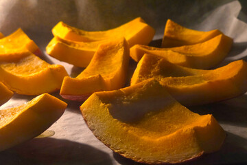 Fresh Pumpkin Slices on Baking Sheet for Autumn Cooking and Recipes